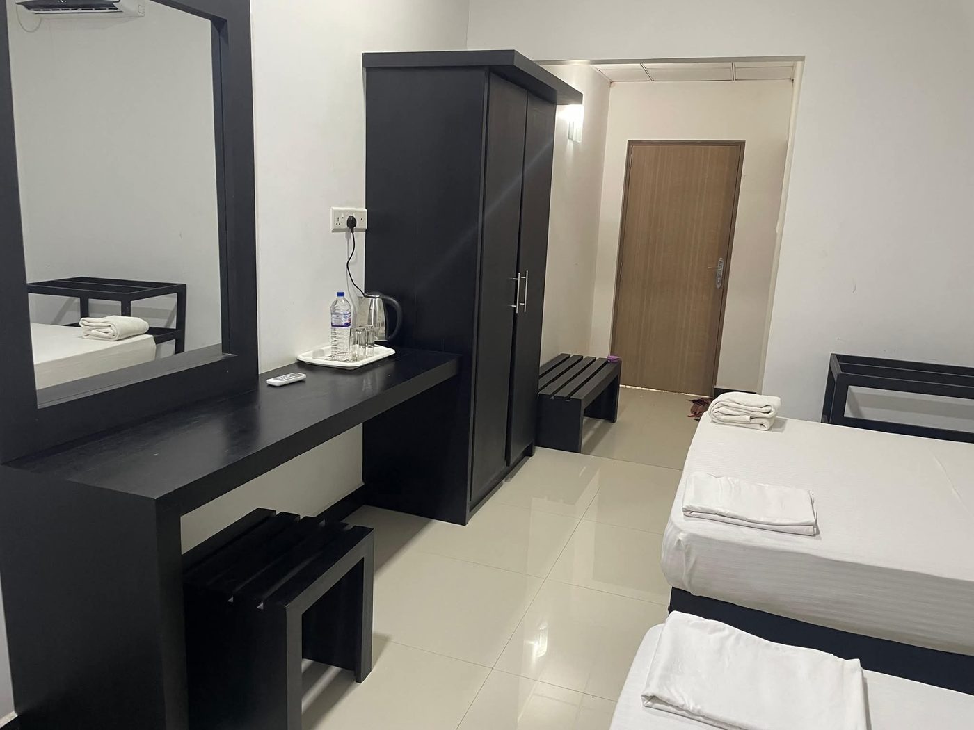 Spacious room with wardrobe, dressing table and mirror